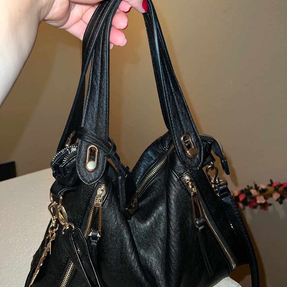 Vegan leather Zipper closure.